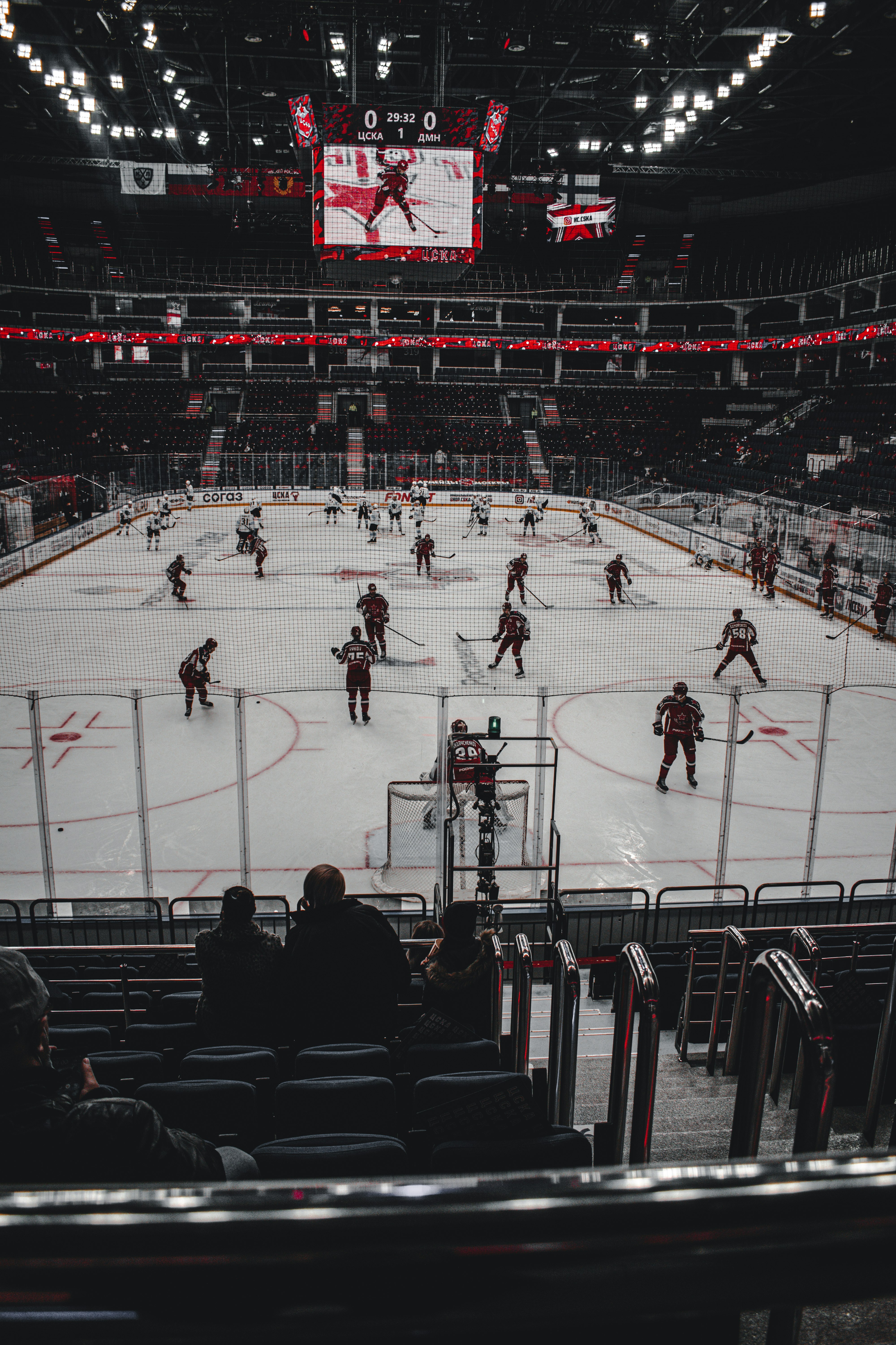 people playing ice hockey on stadium